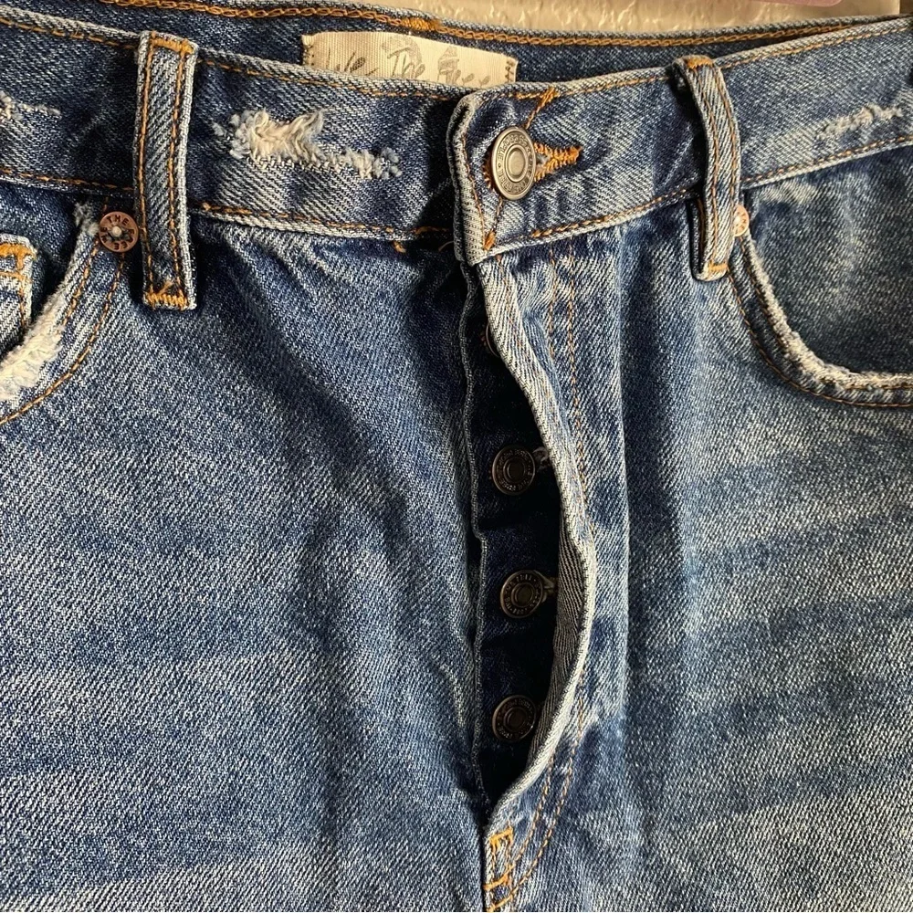 Free People Medium Wash Distressed Raw Hem Denim Shorts